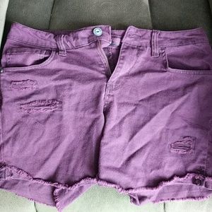 Shorts that are purplish maroon color